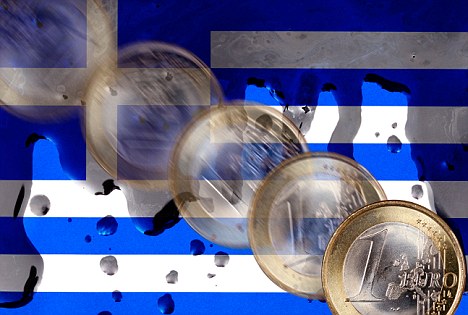 Black fluid on the flag of Greece, falling euro, symbolic picture