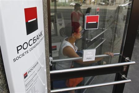 Woman walks out of an office of Rosbank in central Moscow