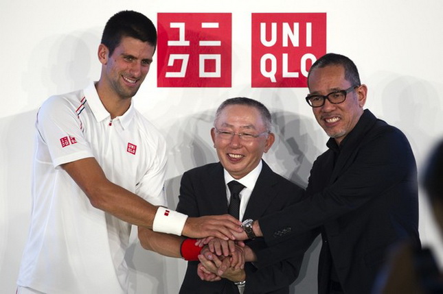Tennis player Djokovic, Chairman and CEO of Fast Retailing Co Yanai and Uniqlo Design Director Takizawa attend the presentation of Djokovic's new sponsorship deal with Uniqlo in Paris