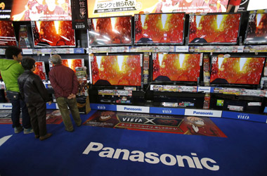 People look at Panasonic Corp's Viera TV screens displayed in an electronics store in Tokyo