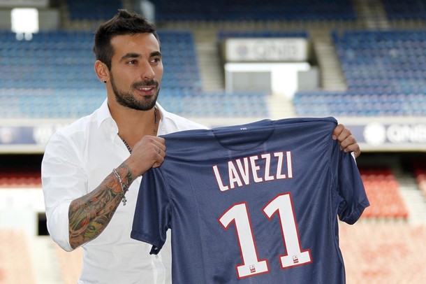 Ezequiel Lavezzi, newly-signed player for French soccer club Paris St Germain, holds his new jersey after  a news conference at the Parc des Princes stadium in Paris