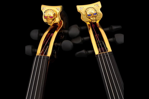 The worlds first gold-plated violins are studded with precious stones and cost $2 million