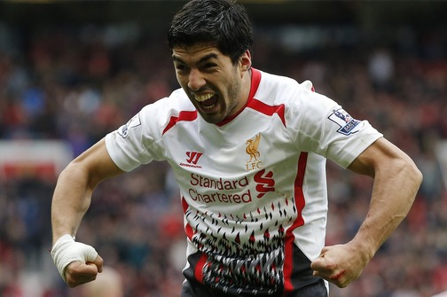 Liverpool's Suarez celebrates after scoring his side's third goal during their English Premier League soccer match against Manchester United at Old Trafford in Manchester