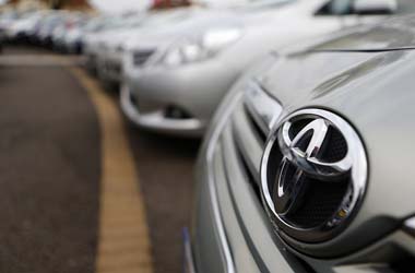 Toyota cars are lined up for sale on the forecourt of a Toyota dealer in Purley, south London