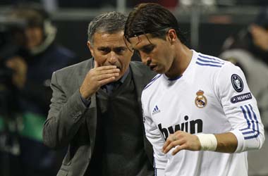 Real Madrid's coach Mourinho talks to Ramos during the Champions League Group G match against AC Milan in Milan