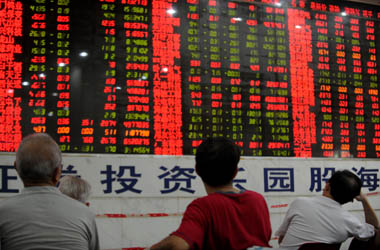 Chinese stock investors check their share prices at a security firm in Wuhan, central China's Hubei province on September 16, 2011. Chinese shares closed up 0.13 percent. The Shanghai Composite Index, which covers both A and B shares, gained 3.29 points to 2,482.34 on turnover of 49.6 billion yuan ($7.8 billion).   CHINA OUT AFP PHOTO (Photo credit should read STR/AFP/Getty Images)