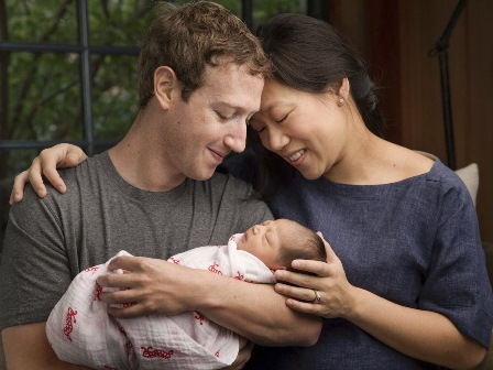 Max Chan Zuckerberg's parents are marking her birth by promising to give most of their Facebook shares to good causes over their lifetimes. The family is pictured in this photo provided by Mark Zuckerberg.