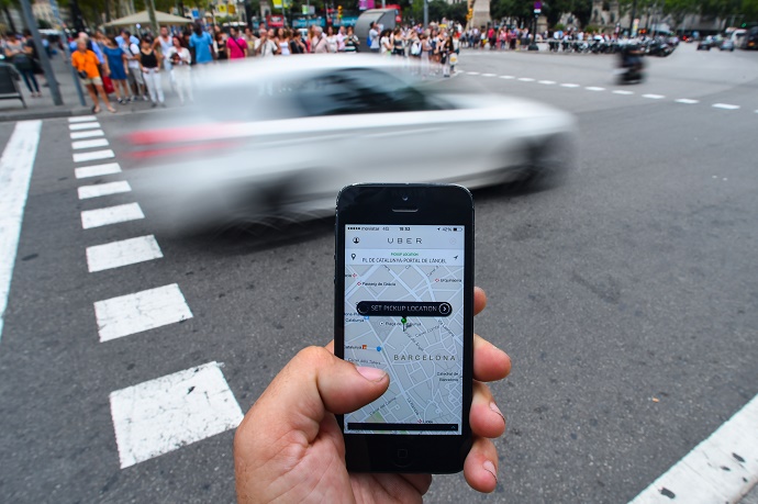 BARCELONA, SPAIN - JULY 01:  In this photo illustration the new smart phone taxi app 'Uber' shows how to select a pick up location on July 1, 2014 in Barcelona, Spain. Taxi drivers in various cities have been on strike over unlicensed car-hailing services. Drivers say that there is a lack of regulation behind the new app.  (Photo by David Ramos/Getty Images)