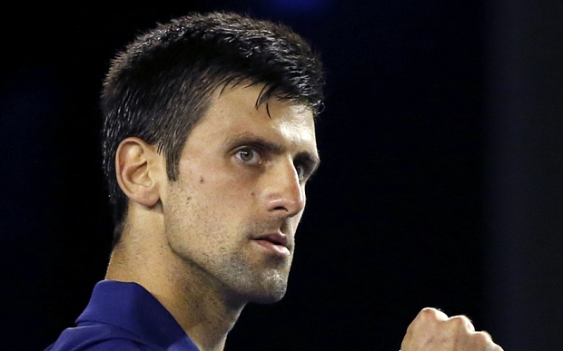 Novak Djokovic of Serbia reacts after winning a point against Quentin Halys of France during their second round match at the Australian Open tennis championships in Melbourne, Australia, Wednesday, Jan. 20, 2016.(AP Photo/Vincent Thian)