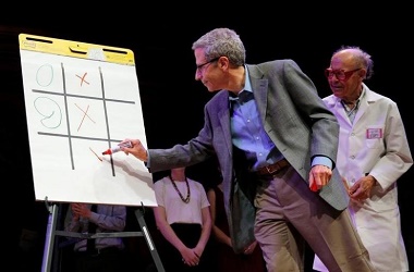 Nobel Laureates Eric Maskin and Dudley Herschbach play "Tick-Tock-Toe" during the 26th First Annual Ig Nobel Prize ceremony at Harvard University in Cambridge
