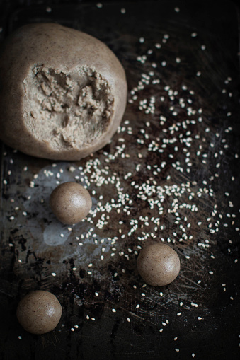 Work in progress for tahini cookies: making small balls with dought