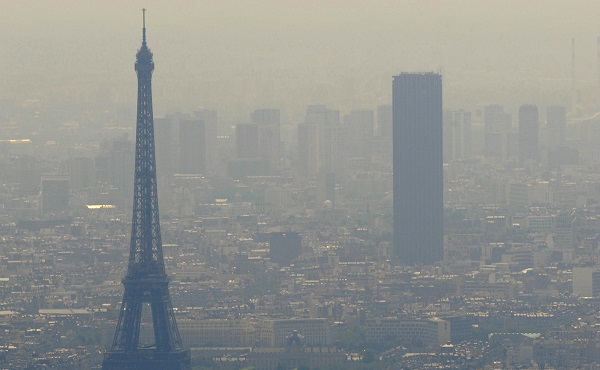 An aerial picture taken aboard an helicopter on July 20, 2010 shows a smoggy view of the Eiffel tower (L) and the Tour Maine-Montparnasse in Paris. AFP PHOTO BORIS HORVAT (Photo credit should read BORIS HORVAT/AFP/Getty Images)
