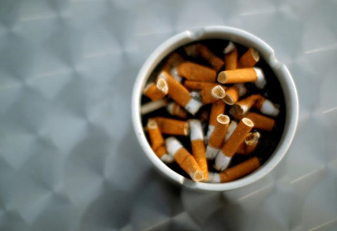 FILE PHOTO: An ash tray with cigarette butts is pictured in Hinzenbach, Austria, February 5, 2012. REUTERS/Lisi Niesner/File Photo