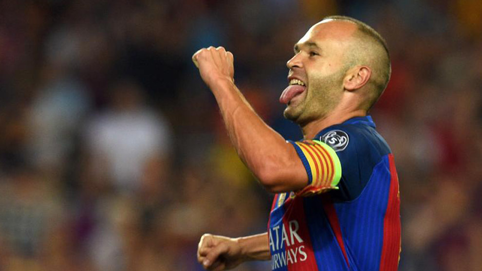 Barcelona's midfielder Andres Iniesta celebrates after scoring a goal during the UEFA Champions League football match FC Barcelona vs Celtic FC at the Camp Nou stadium in Barcelona on September 13, 2016. / AFP PHOTO / LLUIS GENE