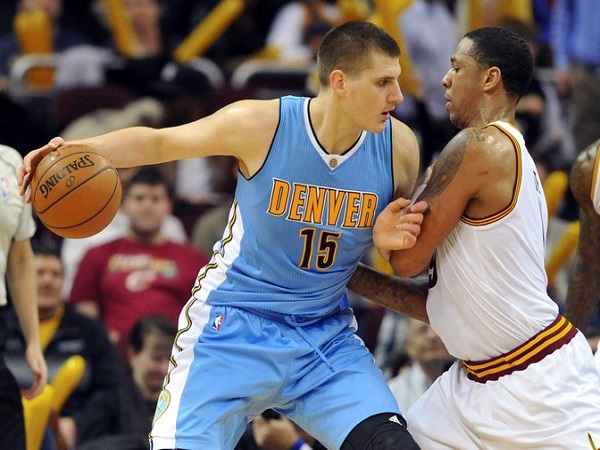 Mar 21, 2016; Cleveland, OH, USA; Denver Nuggets center Nikola Jokic (15) works against Cleveland Cavaliers forward Channing Frye (9) during the third quarter at Quicken Loans Arena. The Cavs won 124-91. Mandatory Credit: Ken Blaze-USA TODAY Sports